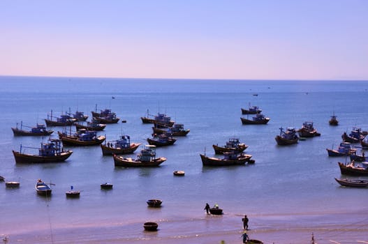View of local fishing boats on the beach in Vietnam