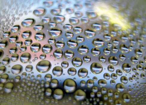 Water drops on the curve transparent surface. Shallow DOF.                                  