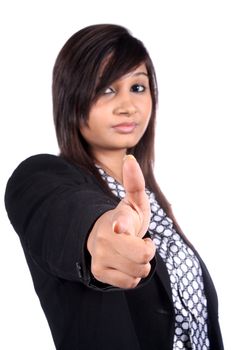A pretty young Indian businesswoman pointing and choosing you for the next assignment, on white studio background.