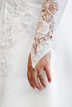 Woman's hand - a wedding white glove