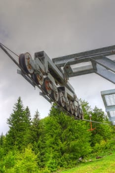 detail of ski lift wheels in a cloudy spring day