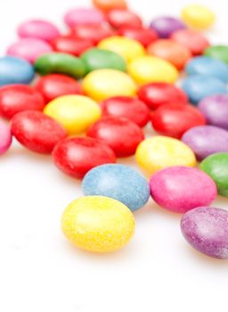 Round Candies in Many Colors on White Background