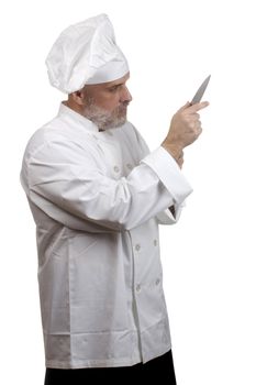 Portrait of a caucasian chef in his uniform on a white background.