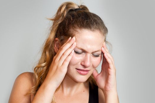 portrait of a caucasian woman with headache 