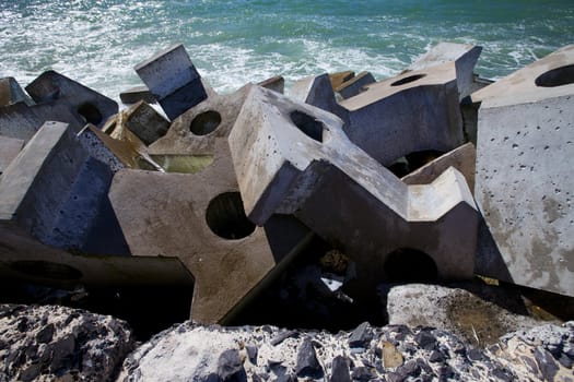 Dolas, Concrete blocks barriors protecting the pier from the sea.