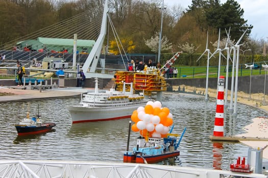 THE HAGUE, NETHERLANDS - APRIL 7: Visiting tourists Madurodam exposition updated April 7, 2012 in Den Haag, The Netherlands