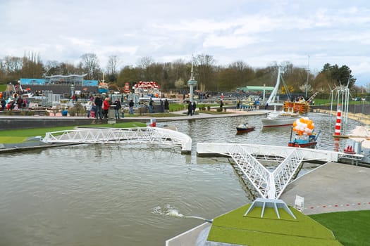 THE HAGUE, NETHERLANDS - APRIL 7: Visiting tourists Madurodam exposition updated April 7, 2012 in Den Haag. Adjustable Dam in the North Sea, The Netherlands