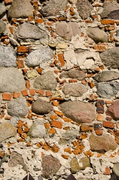 Background of retro stone masonry wall closeup.