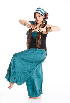 Oriental dancer in blue costume over white background