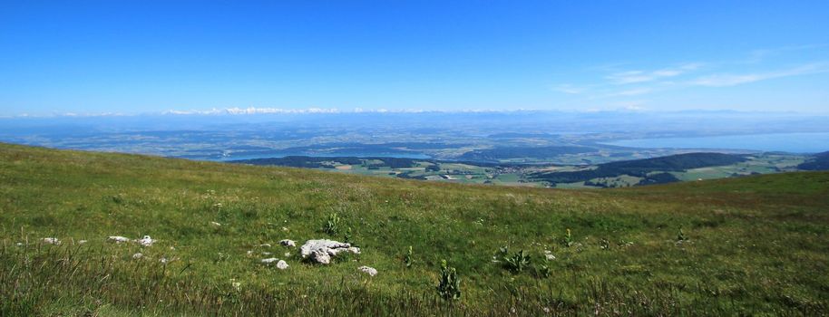 View on all the Alps range mountains from the mount Chasseral, Jura, Switzerland, by beautiful weather