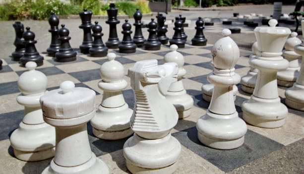 Black and white outdoors chess game in Bastions Park, Geneva, Switzerland