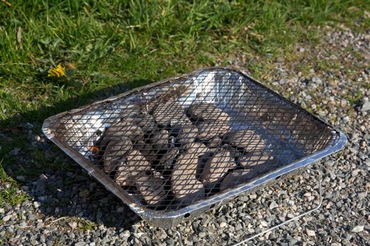 A picture of a one time use barbeque grill