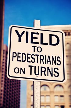 Yield on pedestrians on turns sing in the center of Boston, Massachusetts