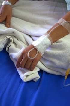 Patient hand before surgery in the hospital.