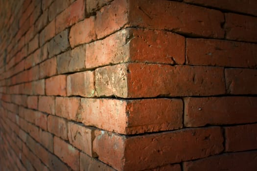 Old red brick wall with a beautiful background.