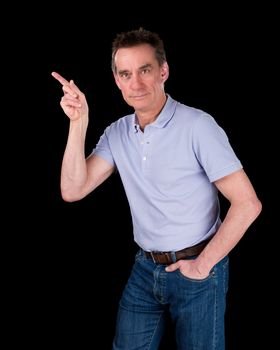 Handsome Middle Age Man Pointing At Something Black Background