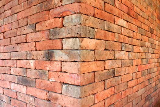 Old red brick wall with a beautiful background.