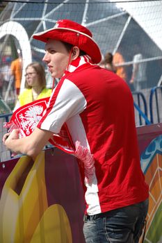 WROCLAW, POLAND - JUNE 8: UEFA Euro 2012, fanzone in Wroclaw. Single Polish fan waiting for first game with Greece on June 8, 2012.