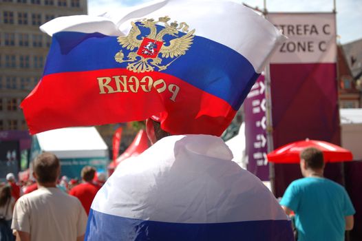 WROCLAW, POLAND - JUNE 8: UEFA Euro 2012, fanzone in Wroclaw, fan with Russian flag heading to fanzone on June 8, 2012.