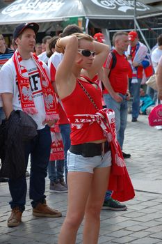 WROCLAW, POLAND - JUNE 8: UEFA Euro 2012, fanzone in Wroclaw. Pretty Polish girl waiting for first game on June 8, 2012.