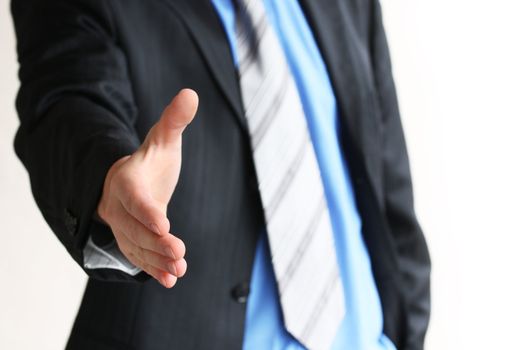 Young business man giving hand for handshake