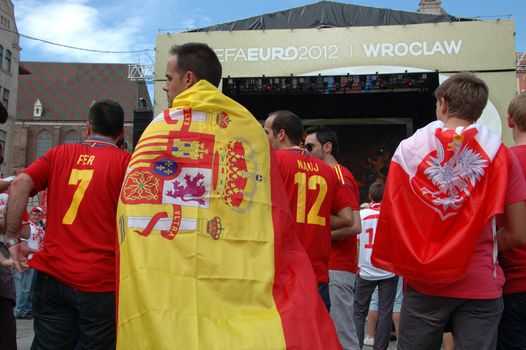 WROCLAW, POLAND - JUNE 8: UEFA Euro 2012, fanzone in Wroclaw. Spanish fan with big flag on June 8, 2012.