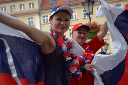 WROCLAW, POLAND - JUNE 8: UEFA Euro 2012, fanzone in Wroclaw. Russian female fans hold flag on June 8, 2012.