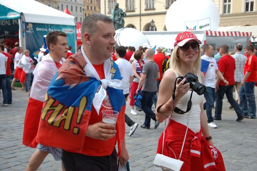 WROCLAW, POLAND - JUNE 8: UEFA Euro 2012, fanzone in Wroclaw. Russian couple visits fanzone on June 8, 2012.