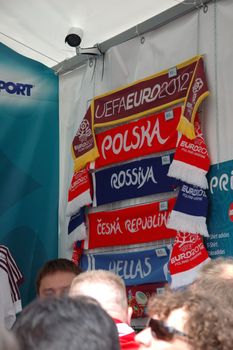 WROCLAW, POLAND - JUNE 8: UEFA Euro 2012, fanzone in Wroclaw. Neckerchief of different teams for sale on June 8, 2012.