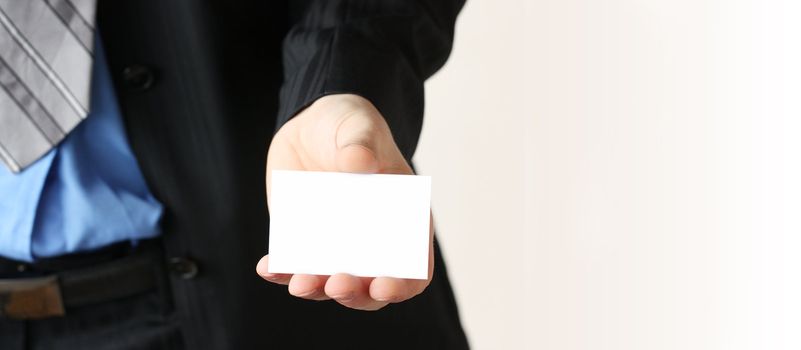 Businessman holding his business card in hand