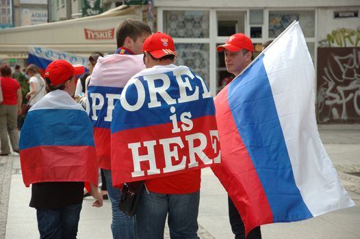 WROCLAW, POLAND - JUNE 8: UEFA Euro 2012, fanzone in Wroclaw. Russian football fans with flag go for game on June 8, 2012.