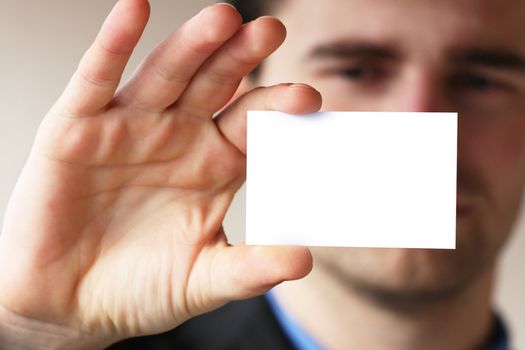 Businessman holding his business card in hand