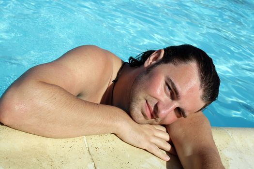 posing in the swimming pool for the photographer