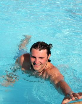 posing in the swimming pool for the photographer