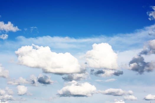 white clouds on blue sky in season