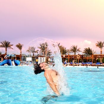 posing in the swimming pool for the photographer