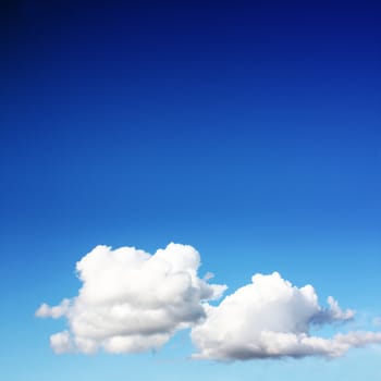 white clouds on blue sky in season