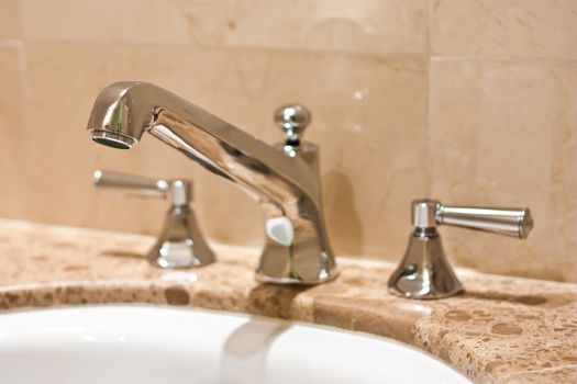 Tap in an Italian luxury hotel, steel on marble