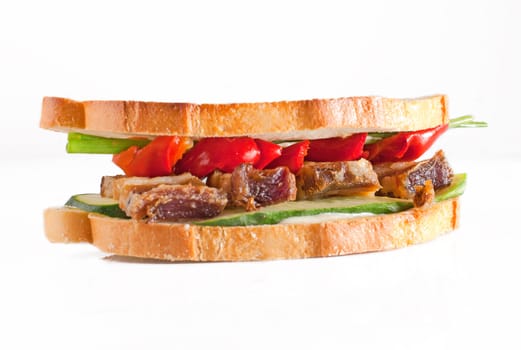 Sandwich with meat and pickled pepper on isolated white background