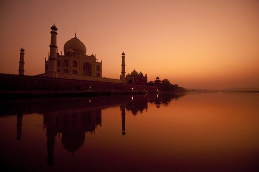 Taj Mahal in sunset view, water reflection of yamuna river