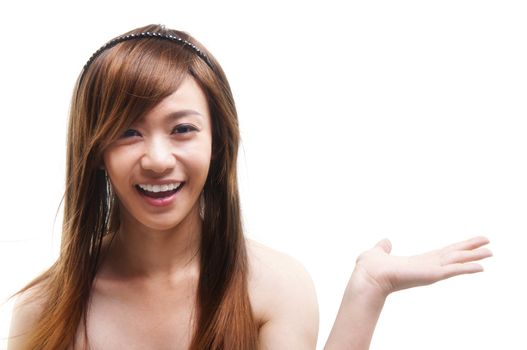 Cheerful young Asian arm out showing empty space, isolated on white