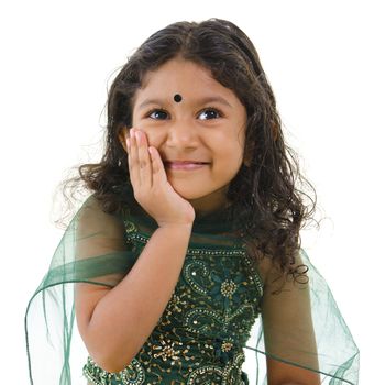 Thoughtful little Indian girl hand on chin , isolated white background