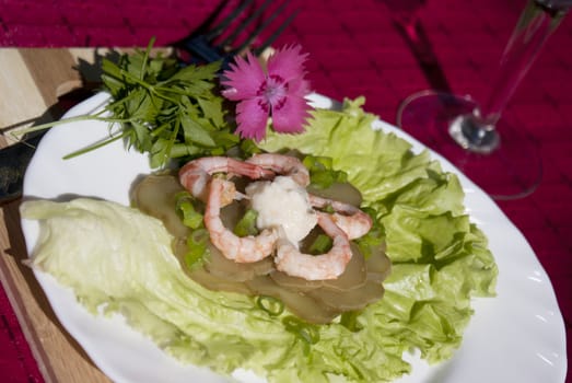 Easy snack from seafood and a marinaded cucumber with a sharp horse-radish