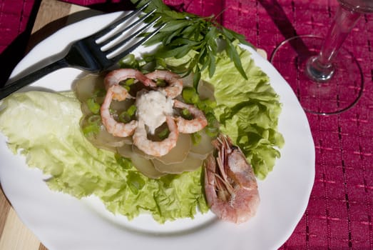 Easy snack from seafood and a marinaded cucumber with a sharp horse-radish