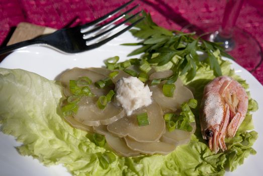 Easy snack from seafood and a marinaded cucumber with a sharp horse-radish