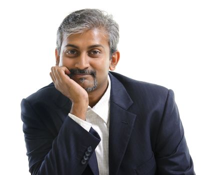 Mature Indian businessman smiling, isolated white background