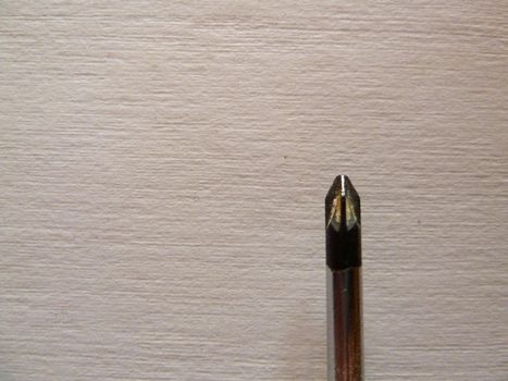 closeup of a screwdriver tip on white background