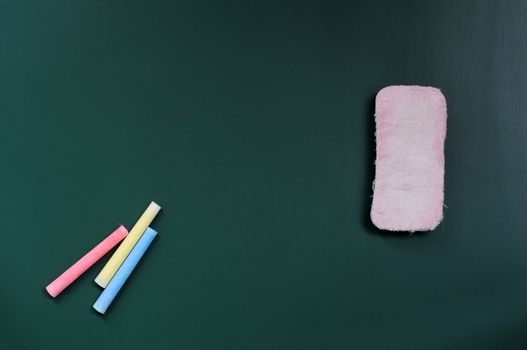 Blank blackboard for copy space with eraser and chalk
