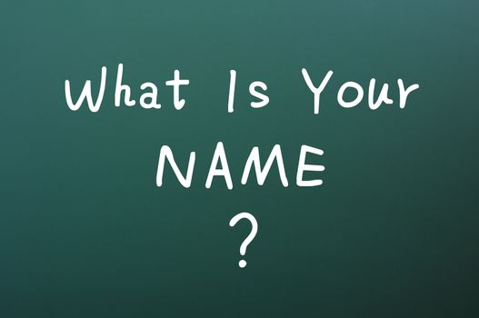 What is your name - question written with white chalk on a blackboard