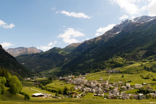 Traditional Swiss Alps mountain landscape with small village